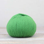 A single ball of The Fiber Co. &Make Aran in color Borealis Bash